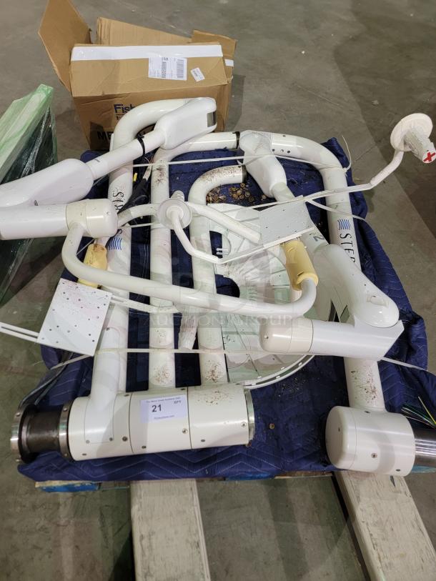 STERIS Harmony LED surgical lighting system, ceiling mount, includes two LED light heads with articulating arms, used condition.