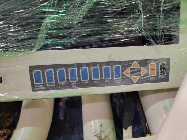 Steris Harmony LED surgical light control panel with covered buttons for inputs and navigation, indicating video connections and power controls.