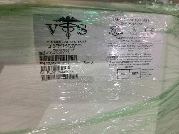 VTS Medical Systems label on wrapped packaging. Shows model VTS-26-HD003, with part number PN: RLM26HD3C, serial number SN: RLM139442122.