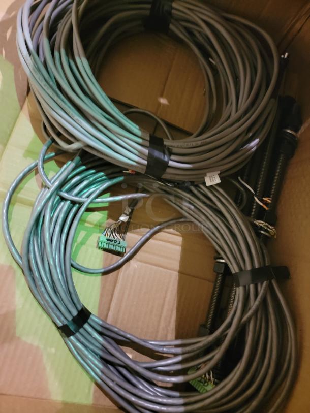 Coiled cables for Steris Harmony LED Surgical Lighting System, featuring connectors and mounting hardware for ceiling installation.