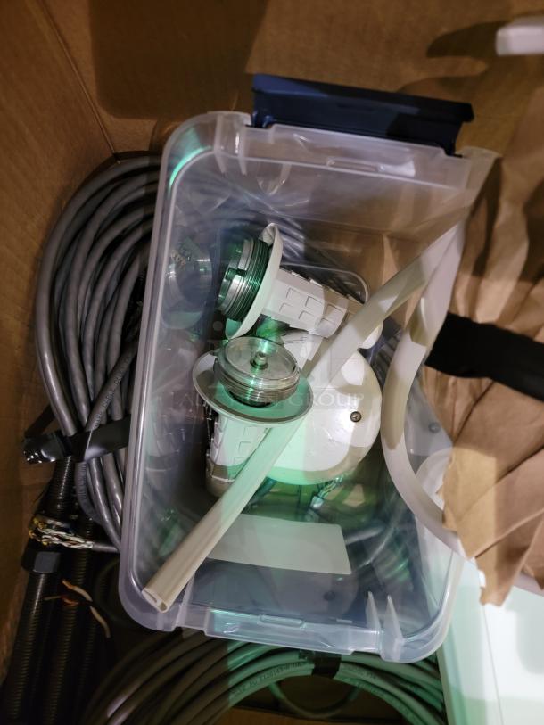 STERIS Harmony LED Surgical Lighting System in packaging, showing LED heads, ceiling mount, and cables, designed for sterile use.