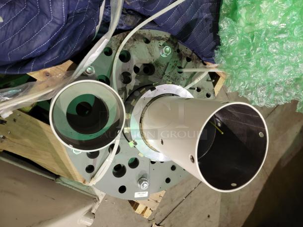 Ceiling mount hardware for Steris Harmony LED surgical lighting system on pallet, includes mounting plate and articulating arm components.