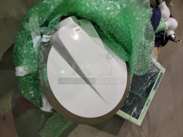 STERIS Harmony LED surgical lighting system with ceiling mount, shown with bubble wrap, features high-intensity LED heads for shadow reduction and deep cavity illumination.