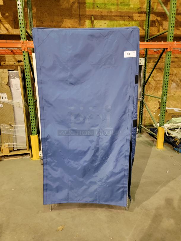 Nexel Industries wire shelving unit with blue nylon enclosure, chrome frame, four adjustable shelves, Velcro closures.