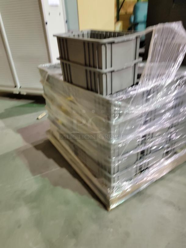 Pallet of approximately 50 Akro-Mils 11x16x5 industrial-grade storage bins, wrapped, with straight-wall design for stacking.
