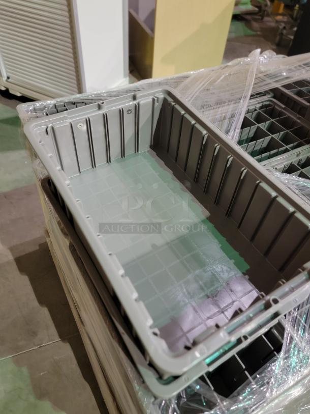 Akro-Mils 11x16x5 grey straight containers, made of high-impact polymer, stacked on pallet, ideal for heavy-duty use.