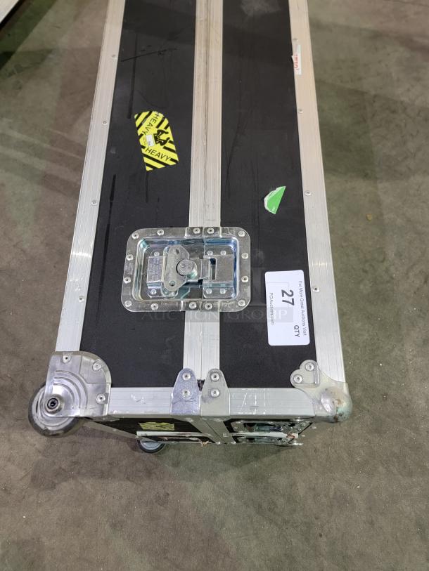 PENN-ELCOM 4' road case with black laminate, aluminum edge, steel corners, foam interior, and swivel casters for equipment.