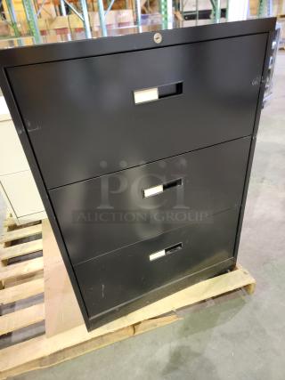Mixed lot of 3 steel lateral file cabinets: black two-drawer, white three-drawer, black two-drawer. Heavy-duty, no keys.