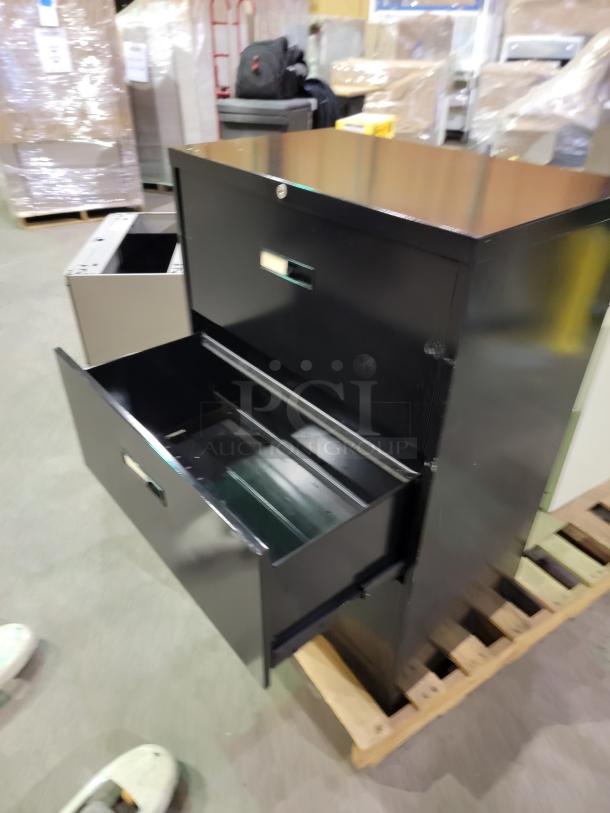 Mixed lot of three steel lateral file cabinets: black two-drawer, white three-drawer, black two-drawer, smooth glides, no keys.