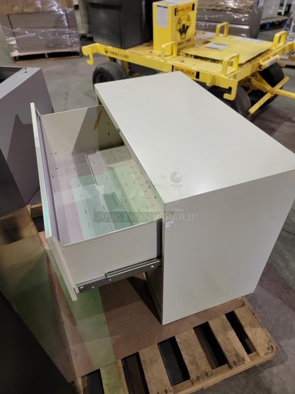 Mixed lot of 3 steel lateral file cabinets, featuring black and white units with smooth-action drawer glides, no keys included.