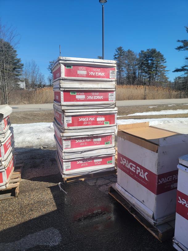 New SpacePak high-velocity HVAC systems, boxed inventory, featuring fan coils and air handlers. Labeled R22 for refrigerant type.