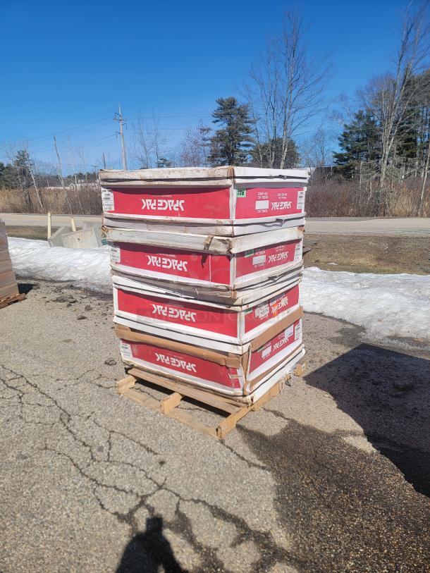 New SpacePak high-velocity HVAC components in boxes on pallet, featuring fan coils, air handlers, and accessories for efficient cooling.