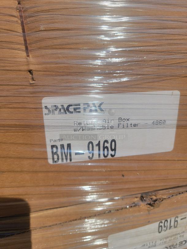 Stack of new SpacePak high-velocity HVAC components in boxes, labeled with part number BM-9169.