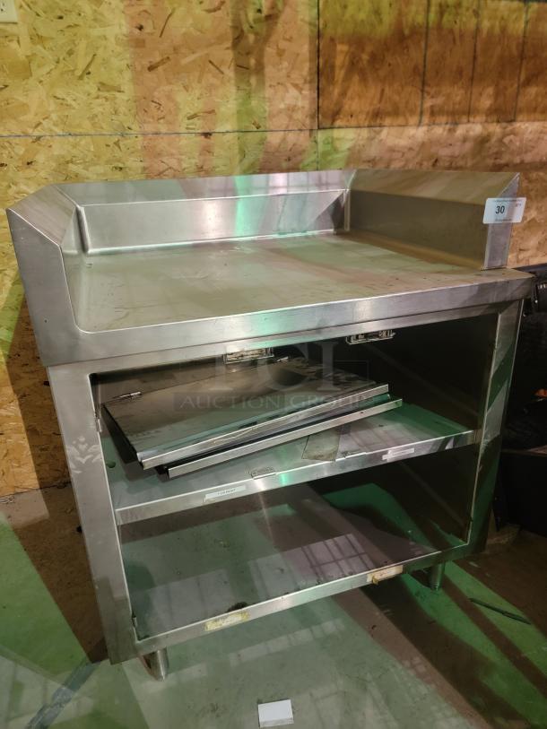Regency stainless steel workstation, 30" x 36", with 4" backsplash and enclosed storage, 14-gauge 304, good condition.