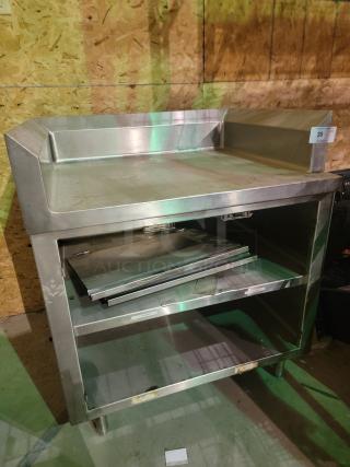 Regency stainless steel workstation, 30" x 36", with 4" backsplash and enclosed storage, 14-gauge 304, good condition.