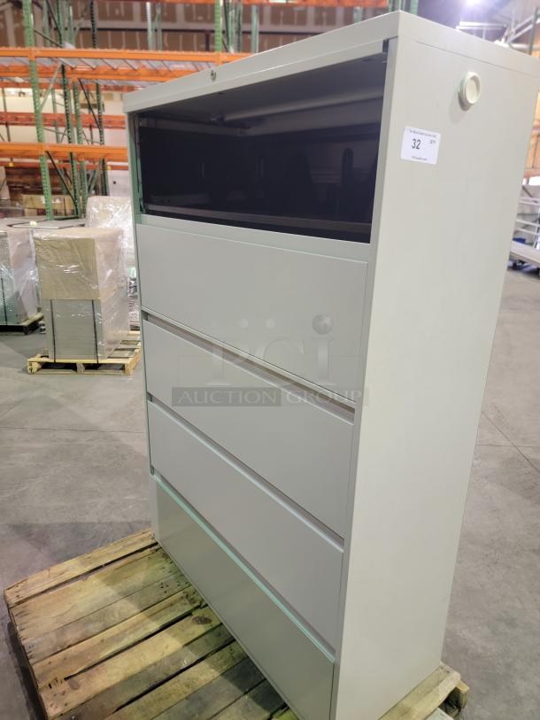 Herman Miller Meridian five-tier lateral file cabinet in neutral tone, stackable design, smooth-pull drawers, lockable with keys.