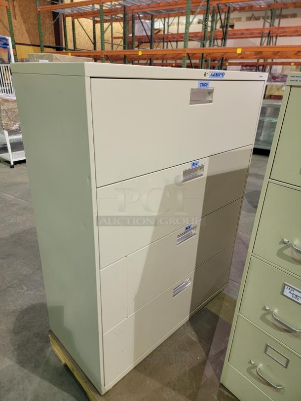 Steelcase 4-drawer lateral cabinet with wide drawers, recessed pulls, and reinforced steel, ideal for office storage.