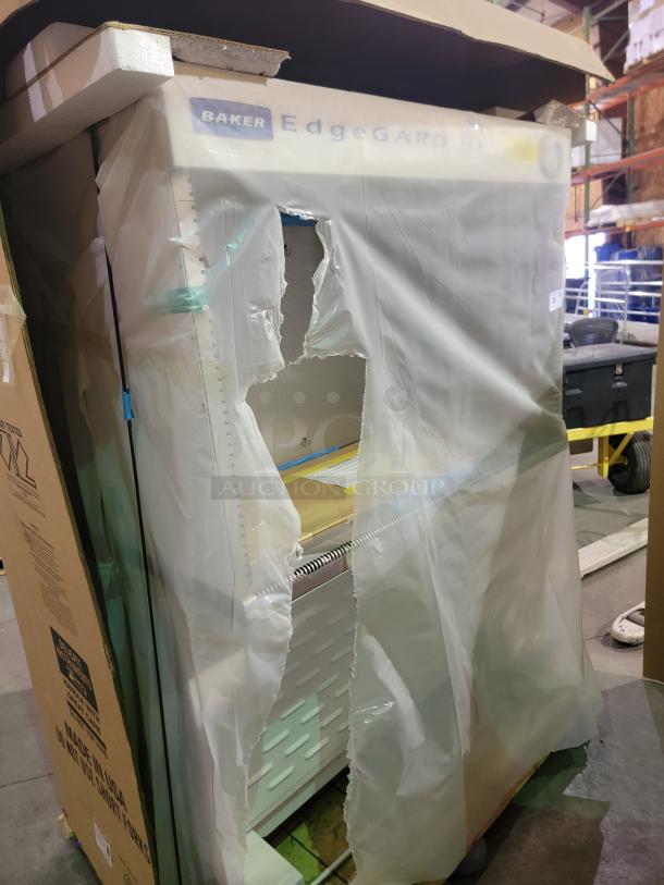 Brand new Baker EdgeGARD EG4252 clean bench in original packaging, featuring ISO Class 5 sterile environment, stainless steel surface, Sensocon monitoring, GFCI outlets.