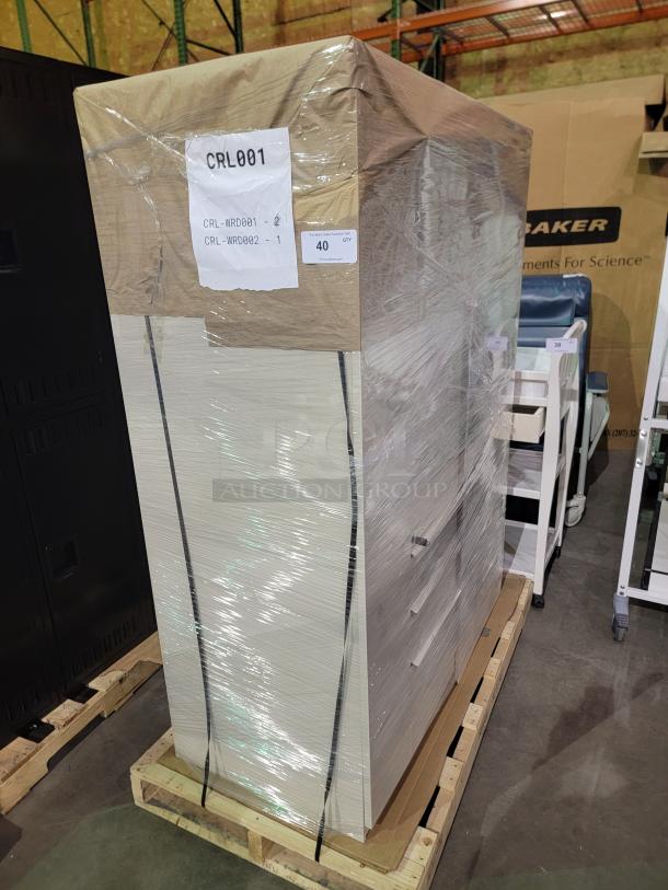 Lot of 2 Herman Miller Meridian storage towers wrapped for shipment, featuring side wardrobe locker and multi-drawer filing system.