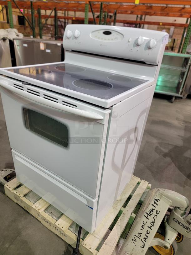 Maytag electric range model MER5751BAW with ceramic glass cooktop and spacious oven. Features electronic controls, white finish.