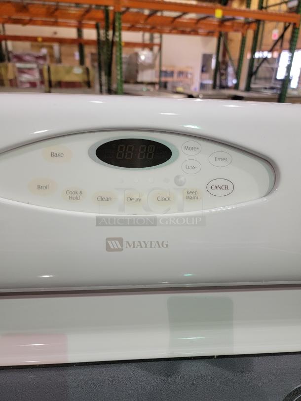 Maytag MER5751BAW electric range control panel with electronic controls, Cook & Hold, Keep Warm, and Self-Cleaning options.