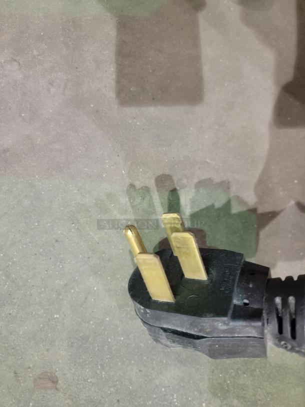 Three-prong plug for Maytag electric range model MER5751BAW. Durable black casing.