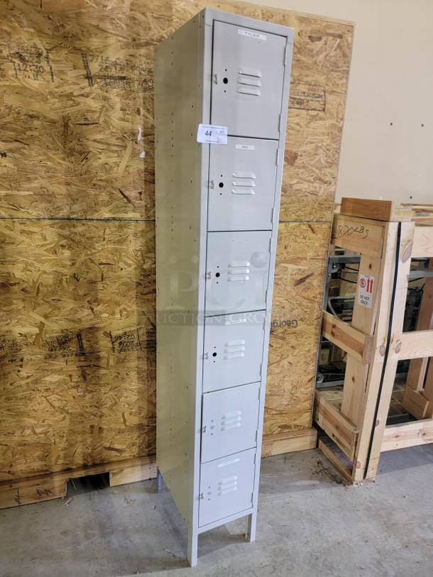 Lyon 6-tier steel locker tower with louvers, gray powder-coated finish, and raised legs for easy cleaning. Durable and ventilated.