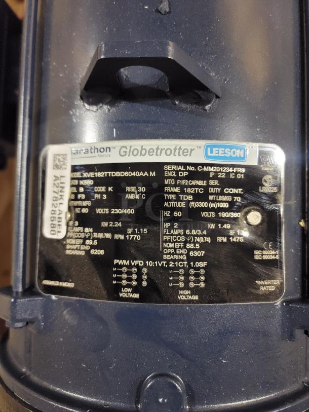 Alt text: Marathon Globetrotter motor label showing model XE182TTDBD6040AA, 3 HP, Volts 230/460, Frame 182TC specifications.