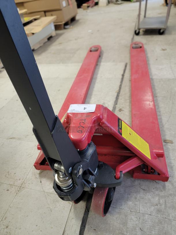 DAYTON 39U68 hand hydraulic pallet truck with 6-foot forks, 4400 lb capacity, reinforced steel, high-performance hydraulics.