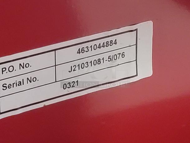Label on Dayton 39U68 pallet truck showing P.O. No. 4631044884 and Serial No. J21031081-5/076, 0321.