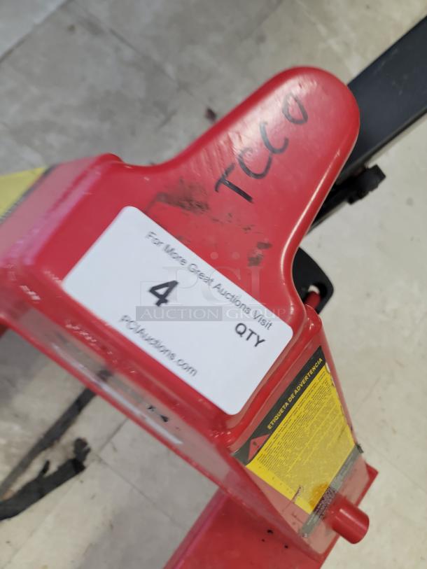 DAYTON 39U68 hand hydraulic pallet truck with 6-foot forks, 4400 lb capacity, reinforced steel, and labels visible.