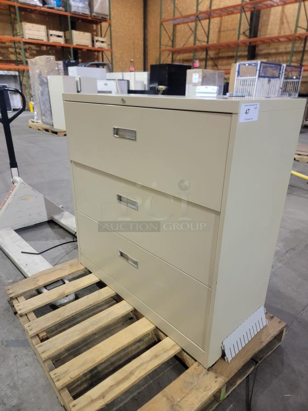 Steelcase 900 Series 3-drawer lateral file cabinet, beige, 42-inch width, heavy-duty ball-bearing glides, recessed pulls.