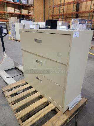 Steelcase 900 Series 3-drawer lateral file cabinet, beige, 42-inch width, heavy-duty ball-bearing glides, recessed pulls.