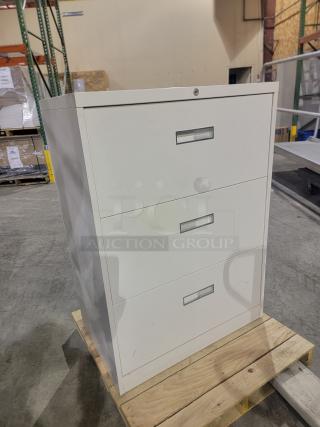 Steelcase 800/900 Series lateral file cabinet in cream finish, featuring three reinforced drawers with recessed pulls.