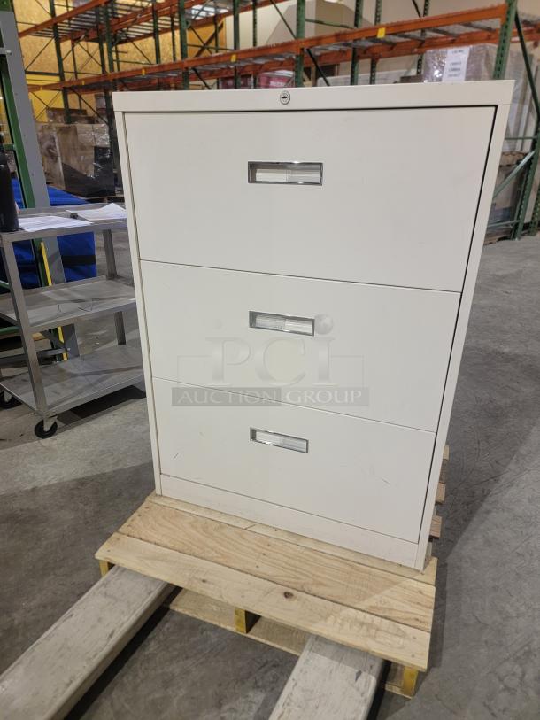 Steelcase 800/900 Series lateral file cabinet, cream finish, three drawers with recessed pulls, durable, high-capacity storage.