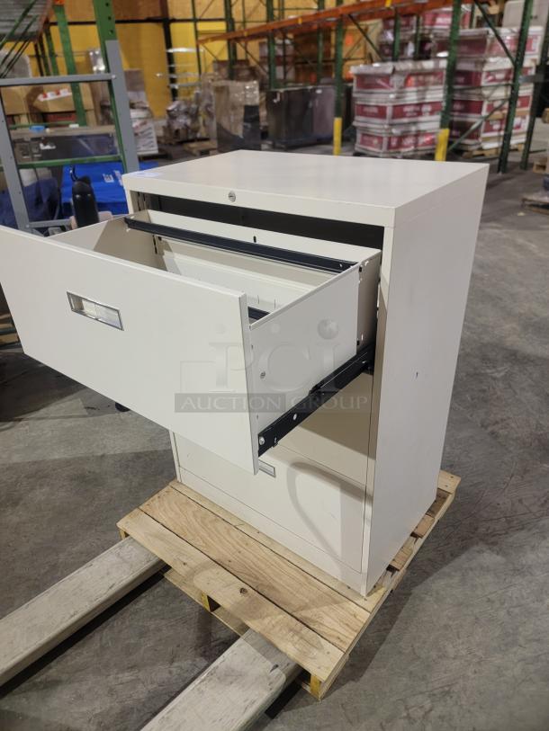 Steelcase 800/900 Series cream lateral file cabinet with three reinforced drawers and smooth telescoping glides, shown open.