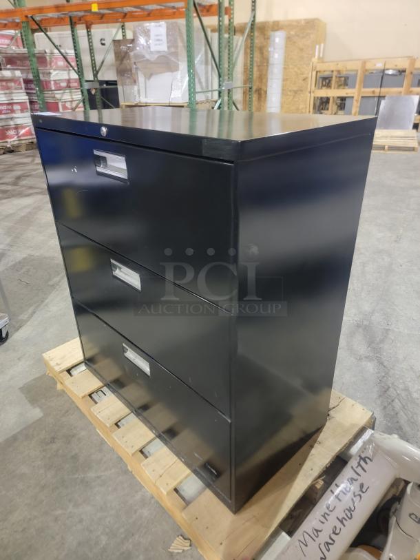 HON 683L lateral filing cabinet, black finish, three drawers with Accuride slides, reinforced steel frame, no key included.