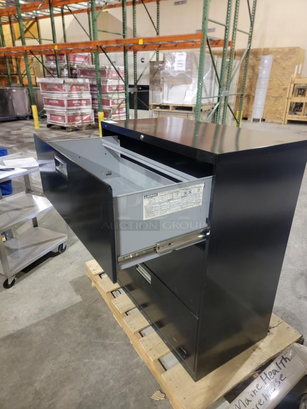 HON 683L black lateral filing cabinet with three drawers on Accuride slides, reinforced steel. Unlocked, key not included.