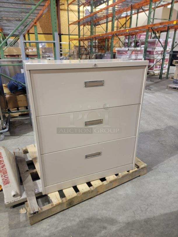 HON 500 Series 3-drawer lateral file cabinet in putty. Reinforced steel, full-extension slides, mechanical interlock, excellent condition.