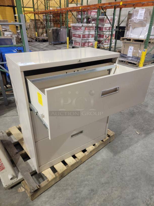 HON 500 Series 3-drawer lateral file cabinet in putty. Features reinforced steel, full-extension slides, and mechanical interlock.