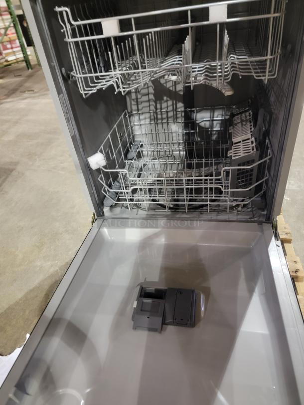 New GE dishwasher with sleek black finish, top control, Dry Boost, Steam Prewash, and Autosense cycle for optimal cleaning.