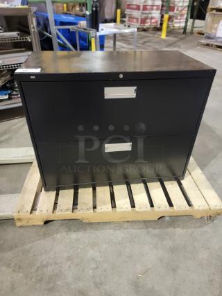 HON Brigade 600 Series 2-drawer lateral file in heavy-duty steel with black finish, recessed handles, and safety interlock system.