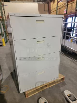 Lot of 2 HON 500 Series steel lateral filing cabinets with key, wide drawers for letter/legal files, robust construction.