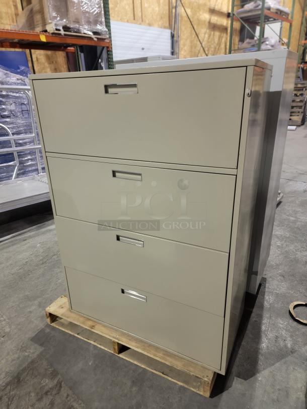 Lot of 2 HON 500 Series lateral filing cabinets, heavy-duty steel, wide drawers for letter/legal files, one key included.