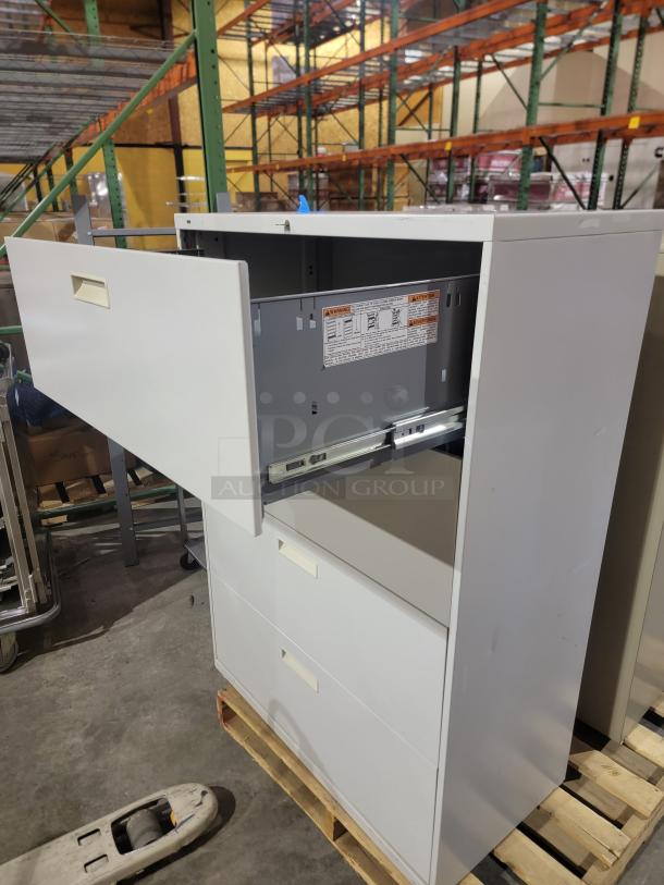 Lot of 2 Hon 500 Series lateral filing cabinets, steel, heavy-duty, wide drawers for letter/legal files, one with key.