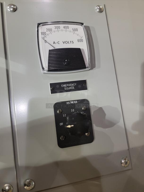 Russelectric Model 2000 Automatic Transfer Switch with A-C volts gauge and voltmeter. Features "Emergency Source" label.