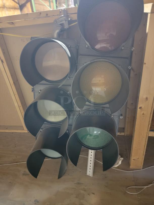 Lot of 5 McCain Traffic Supply 3-section polycarbonate signals with deep visors, weather-resistant, ideal for outdoor use.