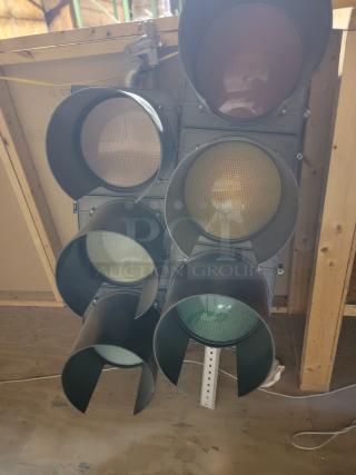 Lot of 5 McCain Traffic Supply 3-section polycarbonate signals with deep visors, weather-resistant, ideal for outdoor use.