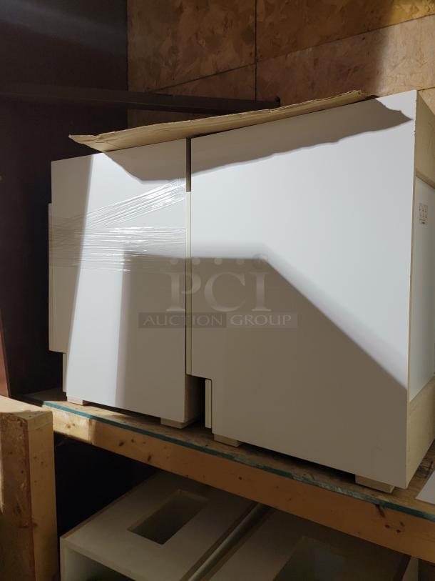 New ML&C Metro Lionville cabinets and Corian Glacier White sinks, in pristine condition, bulk inventory lot.