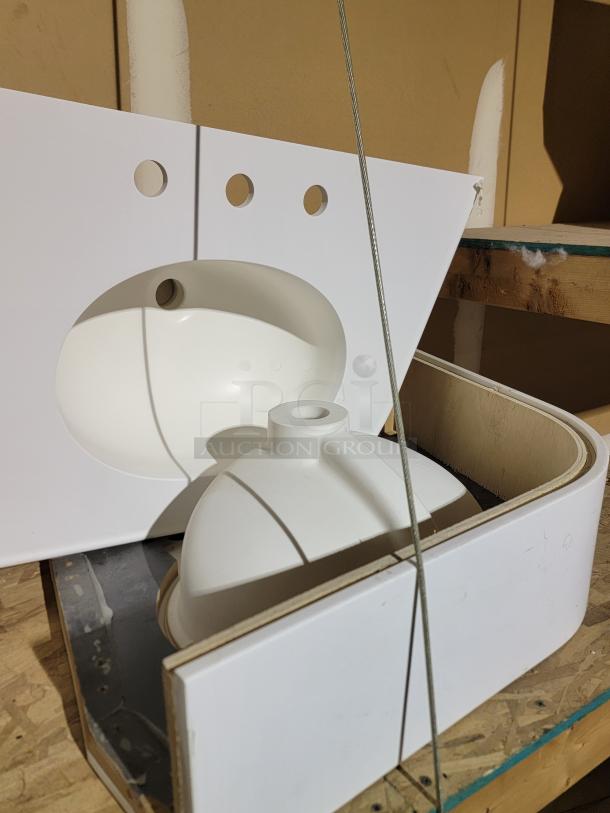 New ML&C Metro Lionville cabinets and Corian Glacier White basins, durable modular cabinetry lot, ideal for commercial use.